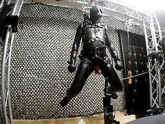 hanging rubber guy getting fucked and milked in suspension