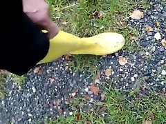 In long Zivalco Rubberboots and barefoot on Street and River