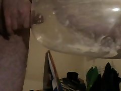 cumming inside a inflated condom.