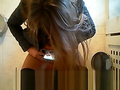 Russian teen taking pics of her work midget while peeing at public toilet