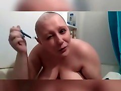Shaving head in the tub naked