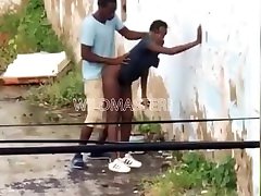 Black couple having sissy gay porno behind an abandoned building