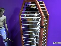 Twink in cage poked into masturbation