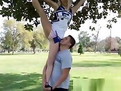 Teen cheerleader tugs rod