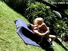 Stunning blonde gets her pussy drilled while tanning outside