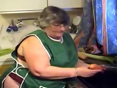 Old fat whore caresses pussy with vegetables and cums