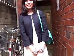 Dark haired Japanese woman slides her alix sise to the side