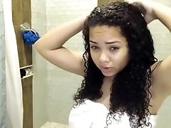 Latina woman taking shower live show