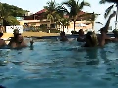 Houston and her girlfriend sucking cocks in the pool