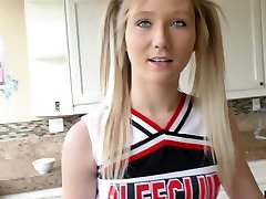 Pretty teen in cheerleader uniform April Aniston gets a mouthful of cum