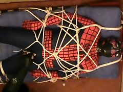 restrained spiderman gets a muzzle and enjoying