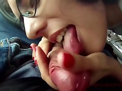 Pigtailed brunette with glasses is sucking her secret lovers dick, while he is trying to drive