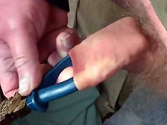 Foreskin with large blue pliers