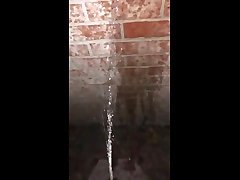 pissing on wall outside