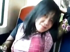 Asian milf rubs her alan and ryan on a train.
