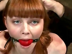 Redhead gets tied tight in various positions in basement getting