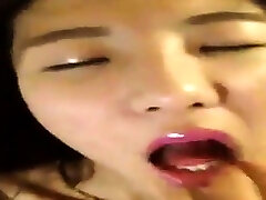 Freaky Asian girl pleasuring herself - selfie
