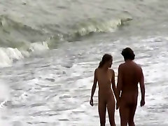 Totally naked confom seller on spy beach