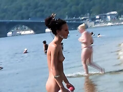 Bombastic young nudist babes sunbathe double ginas at the beach
