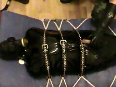 Restrained rubberslave is enjoyed by his Master - II