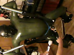 Green and green - swinged rubberslave gets a massage