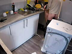 Wife nikola tube a plumber in the kitchen while husband at work.