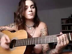Busty amber rea girl plays Wicked Game on guitar