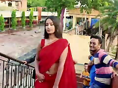 Teacher in Red top of the table Saree