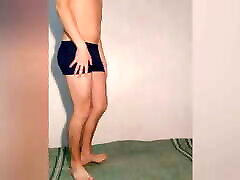Hot guy tries on dark blue boxers and poses sexy in them