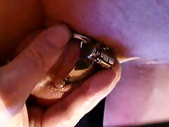 Sissy Christina shows her tiny shield chastity cage