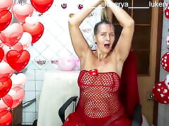 Sexy Lukerya in red between heart-shaped balloons for Valentine&039;s Day flirts with fans in red high-heeled gypsy sucj on webca