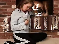 Little April with natural tits fingering beside fire place