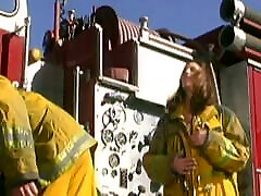 tow girl fingers luxurious brunette gets her hole drilled by fire man near the fire truck