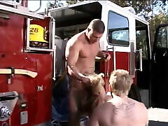 Stunning young big tit blonde takes on two giant firemen cocks at once