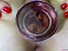 Meaty video hack grips glass dildo close up