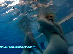 This lovely girl shows her big tits underwater in the tenege age poron while the cam is watching her!