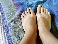 Anita Coxhard models her feet and her husband Mike Coxhard cums on them