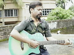 DESI COUPLE SINGING WITH GUITER IN ROOF OUTDOOR