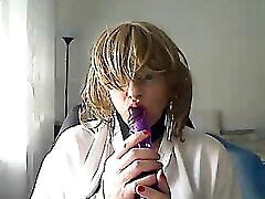 horny MILFhorny MILF tranny in front of webcam simulates a rodney jasmyne while playing with a vibrator in her mouth
