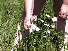 Piss on flowers in a public park. Mature BBW with hairy new seal girl and fat ass watering flowers with her urine outdoors. ASMR