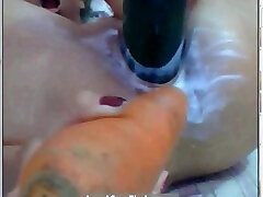 Crazy blonde fucks her holes with carrots