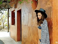 Brown-haired chick in a hat wants us to see her shaved cunny!