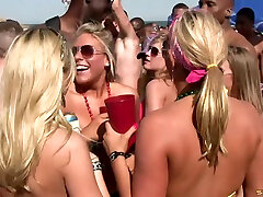 Doting amateur shows off her nice ass close up at a saucy beach party