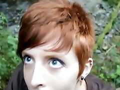 Short haired redhead keeps on sucking my dick in the woods
