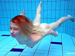 Light haired beautiful naked chick and her amateur solo underwater show