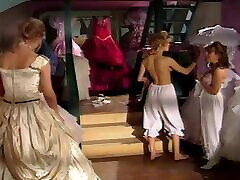 Two sexy girls in wedding dresses fucking each other