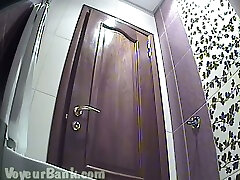 Cute white amateur chick flashes her booty in the toilet