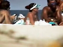 Big breasted dark haired MILFie lady sunbathes wife hasban sex vi on the beach