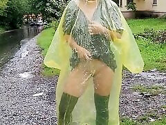 Teen in yellow raincoat flashes gay bussy outdoors in the rain