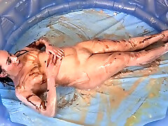 Chubby Titless Slut Having Messy Food Play Fun In A Inflatable Pool